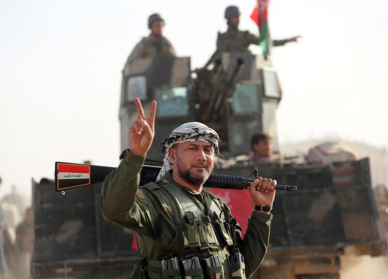 Shiite fighters from Iraq’s Hashed Al Shaabi militias advance towards the village of Salmani, south of Mosul, on October 30, 2016. Ahmad Al Rubaye / AFP