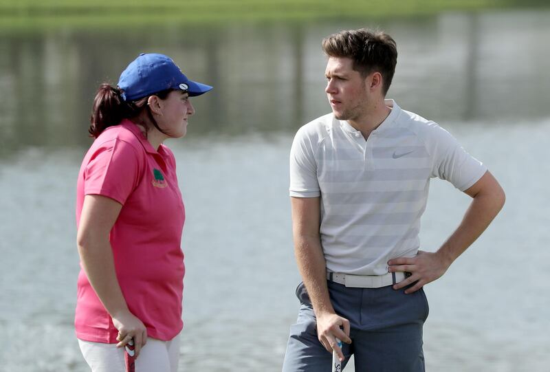 Niall Horan with Saoirse Lambe of Ireland who won a global competition to play in the pro-am at Emirates Golf Club. David Cannon / Getty Images