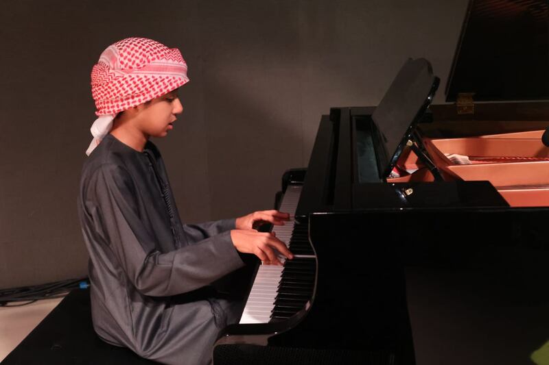Ahmed Al Mousawi, 12, is autistic and has an award-winning talent for playing the piano. All photos: Al Mousawi family