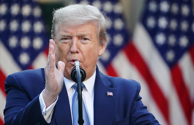 US President Donald Trump gestures as he speaks during the daily briefing on the novel coronavirus, which causes COVID-19, in the Rose Garden of the White House on April 15, 2020, in Washington, DC.  / AFP / MANDEL NGAN
