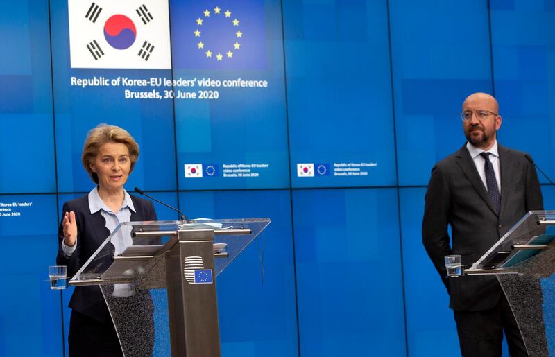 epa08517262 European Commission President Ursula von der Leyen (L) and European Council President Charles Michel (R) attend a media conference after an EU-Republic of Korea summit in video conference format at the European Council building in Brussels, Belgium, 30 June 2020. The summit's agenda was topped by an exchange on the maesures taken to tackle the pandemic COVID-19 coronavirus outbreak and a strategic partnership between the EU and South Korea.  EPA/Virginia Mayo / POOL