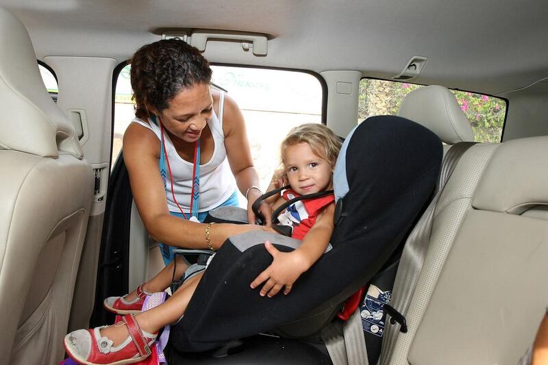 A properly fitted car seat and save a child's life. Pawan Singh / The National