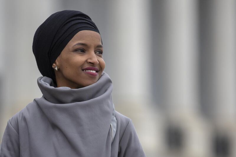 Representative Ilhan Omar, Democrat from Minnesota, smiles during a news conference in Washington, D.C., U.S., on Friday, March 8, 2019. House Democrats are set to approve H.R. 1, a far-reaching elections and ethics bill that would change the way congressional elections are funded, impose new voter-access mandates on states, require groups to publicize donors and force disclosure of presidential candidates' tax returns. Photographer: Alex Edelman/Bloomberg