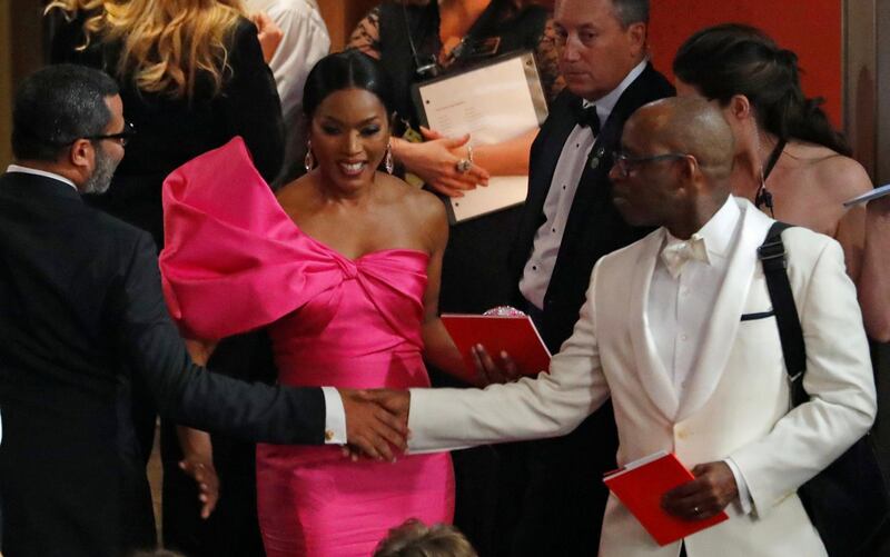 Jordan Peele (L), Angela Bassett (C) and Courtney B. Vance catch up before the start of the 91st Academy Awards show. Photo: Reuters