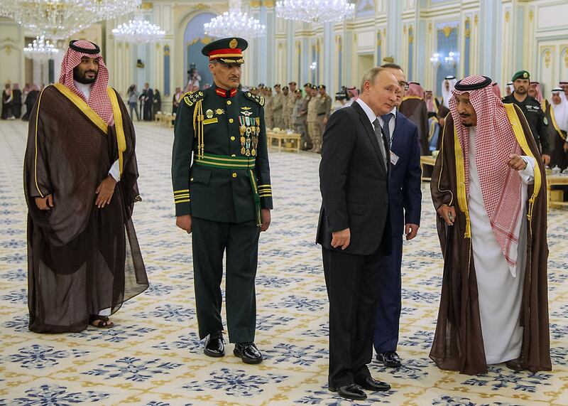 Prince Mohammed bin Salman, Saudi Brigadier General Yussef Saleh Al Salim, second left, Mr Putin and King Salman during a welcome ceremony. AFP