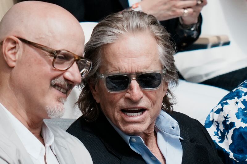 Veteran actor Michael Douglas, centre, at the French Open final in Paris on Sunday. AP