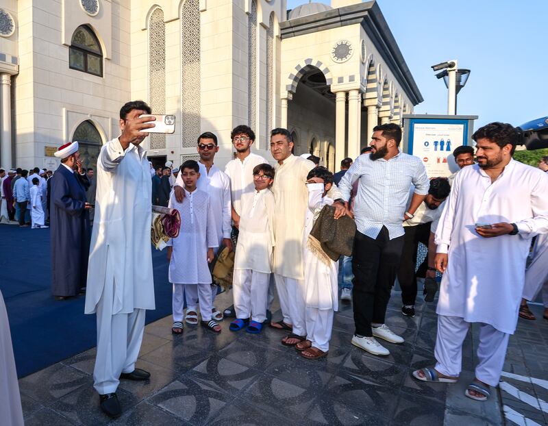 People prepare to perform prayers and celebrate Eid festivities.