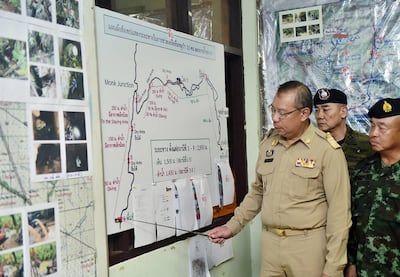 epa06876130 A handout photo made available by the Thai Government Spokesperson's office shows Narongsak Osottanakorn (R), Commander of the Joint Administration Center for Rescue Operations at Tham Luang Cave, briefing Thai Prime Minister Prayut Chan-o-cha (not pictured) on the rescue operation of a group of youth soccer players trapped in the cave, in Chiang Rai province, Thailand, 09 July 2018. According to reports, eight boys have been so far being rescued and evacuated to a hospital as rescue efforts continue for the remaining members of a 13 youth soccer team, including their assistant coach, who have been trapped in the Tham Luang cave since 23 June 2018.  EPA/THAI GOVERNMENT SPOKESPERSON'S OFFICE HANDOUT  HANDOUT EDITORIAL USE ONLY/NO SALES