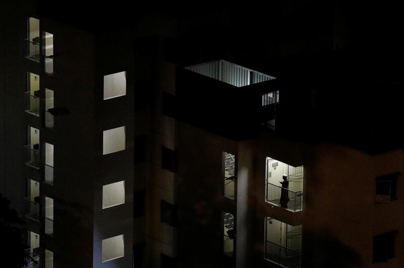 A migrant worker prays after breaking fast in the morning during Ramadan, at a dormitory  in Singapore. Reuters