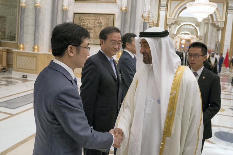 ABU DHABI, UNITED ARAB EMIRATES -October 29, 2018: HH Sheikh Mohamed bin Zayed Al Nahyan, Crown Prince of Abu Dhabi and Deputy Supreme Commander of the UAE Armed Forces (R), greets a member of the delegation accompanying HE Wang Qishan, Vice President of China (not shown), during a reception at the Presidential Palace.
( Hamad Al Kaabi / Crown Prince Court - Abu Dhabi )
---