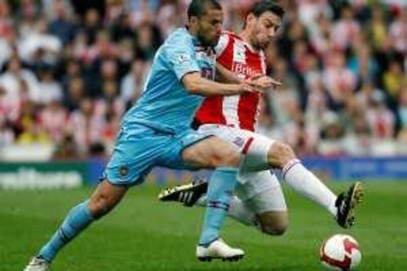 Stoke City's Rory Delap, right, battles for the ball with West Ham United's  Diego Tristan during their English Premier League soccer match   at the Britannia stadium, Stoke, England. Saturday, May 2, 2009. (AP Photo/Simon Dawson)**NO INTERNET/MOBILE USAGE WITHOUT FOOTBALL ASSOCIATION PREMIER LEAGUE (FAPL) LICENCE. CALL +44 (0) 20 7864 9121 or EMAIL info@football-datco.com FOR DETAILS ** *** Local Caption ***  BSD101_BRITAIN_PREMIER_LEAGUE_SOCCER.jpg