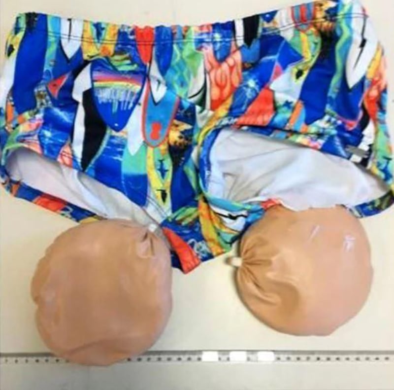 Portuguese police released this image of multicoloured swim trunks with two brown rubber bags — supposed to look like buttocks — attached. The passenger who was wearing them was caught at the airport in Lisbon, off a flight from Belem in northern Brazil in February 2018. The fake buttocks contained enough cocaine for 5,000 doses. Photo: Portuguese National Police