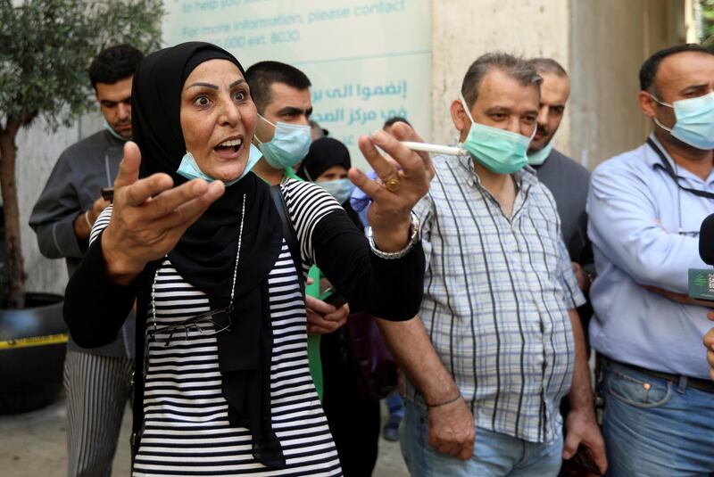 A woman gestures outside American University of Beirut medical centre in Beirut, Lebanon. Reuters