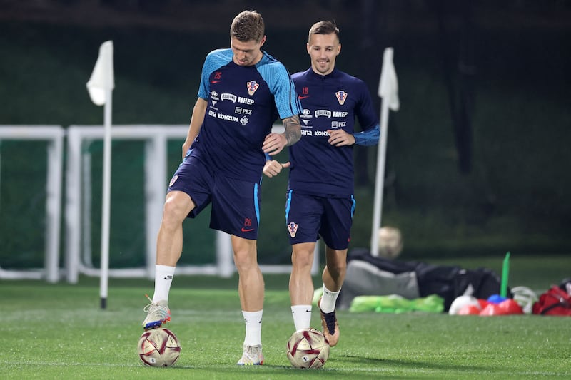 Croatia's Kristijan Jakic, left, and Mislav Orsic take part in a training session ahead of their third place play-off against Morocco. AFP