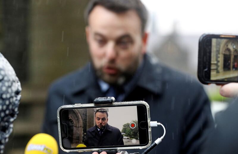 Colum Eastwood, the current leader of the Social Democratic and Labour Party, speaks to the media while waiting for the funeral of John Hume outside St Eugene's Cathedral. Reuters