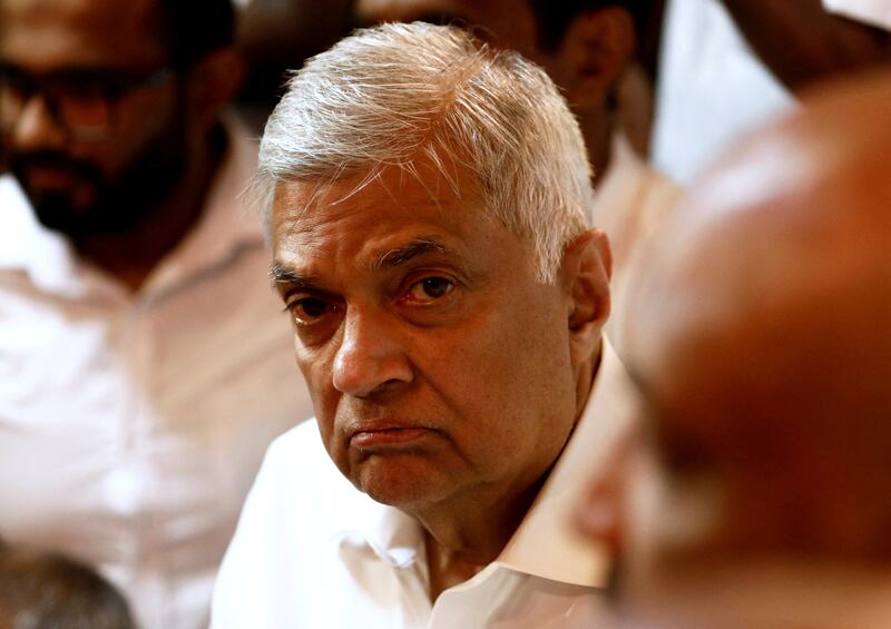 Sri Lanka's Prime Minister Ranil Wickremesinghe arrives at a Buddhist temple in Colombo after his swearing-in ceremony on Thursday.  Reuters