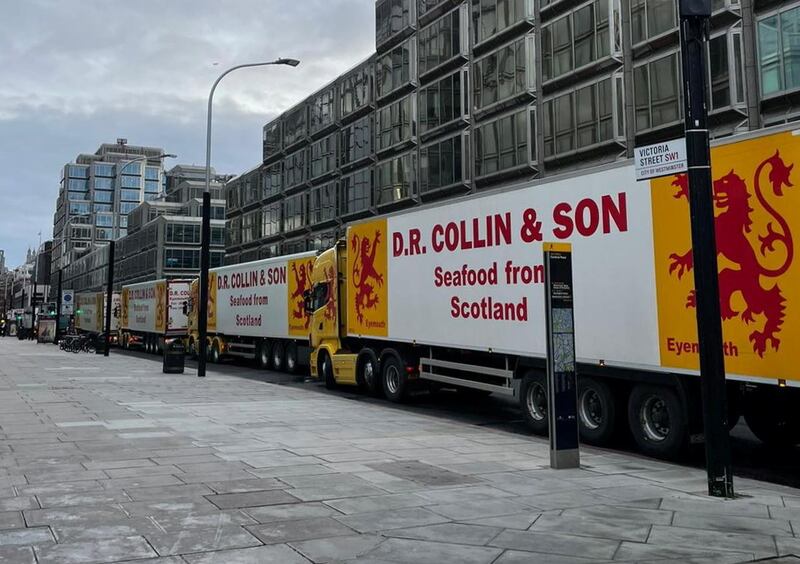 Lorries of Scottish seafood company D.R. Collin & Son Ltd are seen on a street during a protest in London. Reuters