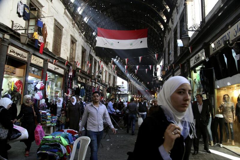 Iranian businessmen are establishing a foothold in Syrian shopping areas. Diaa Hadid / AP Photo