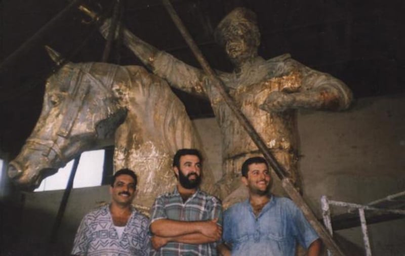 From left, Taha Wohayib, Natiq Al Alousi and Anas Al Alousi in 1998 at the Bronze Foundry in Baghdad.  Courtesy Natiq Al Alousi