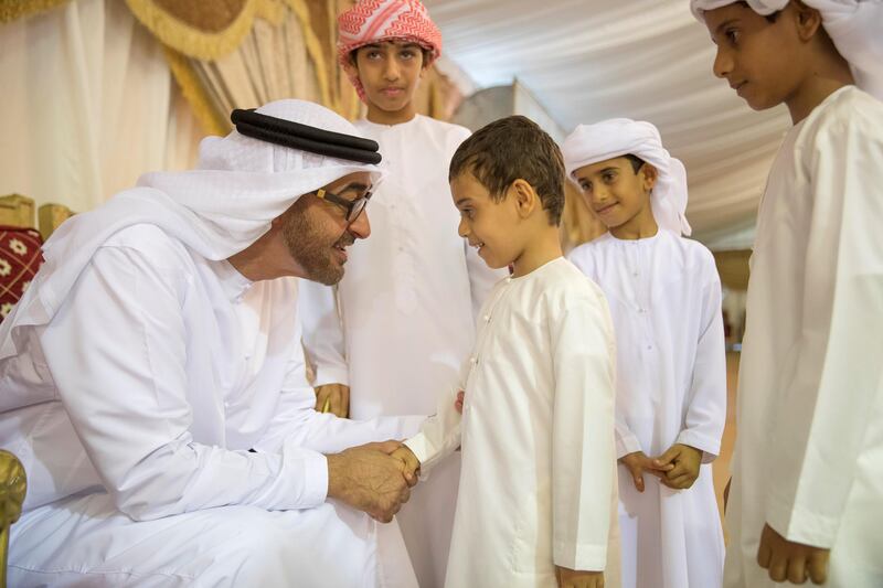 FUJAIRAH, UNITED ARAB EMIRATES - August 13, 2017: HH Sheikh Mohamed bin Zayed Al Nahyan, Crown Prince of Abu Dhabi and Deputy Supreme Commander of the UAE Armed Forces (L), offers condolences to the son of martyr Mohamed Rashed Al Hassani, who passed away while serving with the UAE Armed Forces in Yemen.

( Mohamed Al Hammadi / Crown Prince Court - Abu Dhabi )
---