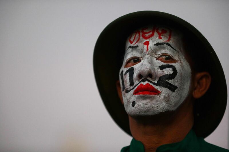 A pro-democracy protester takes part in a rally to denounce the use of the lese majeste law, under section 112 of the penal code, in Bangkok. AFP