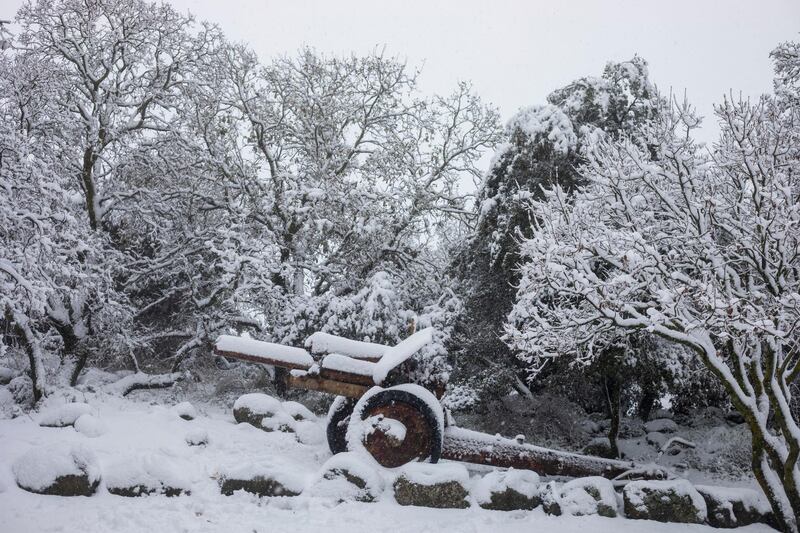 An old mobile artillery piece form Mideast wars sits covered with snow in a memorial site near the Quneitra border crossing between Syria and the Israeli-controlled Golan Heights Wednesday, Feb. 17, 2021. (AP Photo/Ariel Schalit)