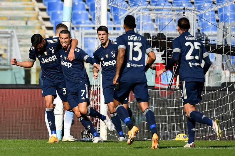 Cristiano Ronaldo, second right, celebrates scoring Juve's first goal with teammates. Reuters