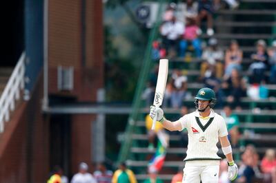 Australian batsman Tim Paine raises his bat as he celebrates scoring half century (50 runs) on the third day of the fourth Test cricket match between South Africa and Australia won by South Africa at Wanderers cricket ground on April 1, 2018 in Johannesburg, South Africa.   / AFP PHOTO / GIANLUIGI GUERCIA
