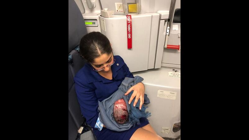 A photograph of the newborn wrapped in an MEA blanket and being cradled by one of the cabin crew has been widely shared online. The photograph originated from an aviation interest group called Lebanese Plane Spotters. Courtesy: Lebanese Plane Spotters