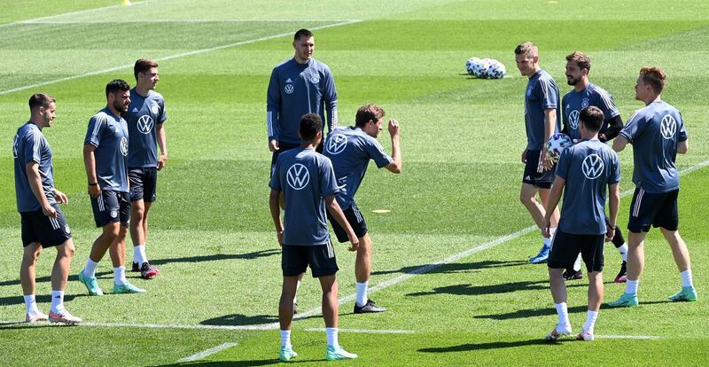 Germany attacker Thomas Muller, centre, srurrounded by teammates at training. AFP