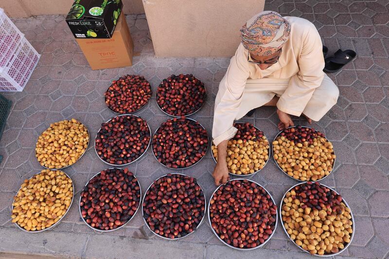 A vendor sells dates at Nizwa souq