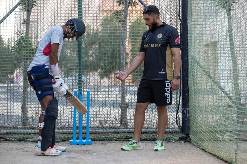 Rameez Shahzad gives tips to young UAE all-rounder Nilansh Keswani at nets at Zenith Cricket Academy.
