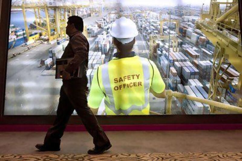 A man walks past the DP World display at the World Ports and Trade Summit in Abu Dhabi yesterday. Christopher Pike / The National