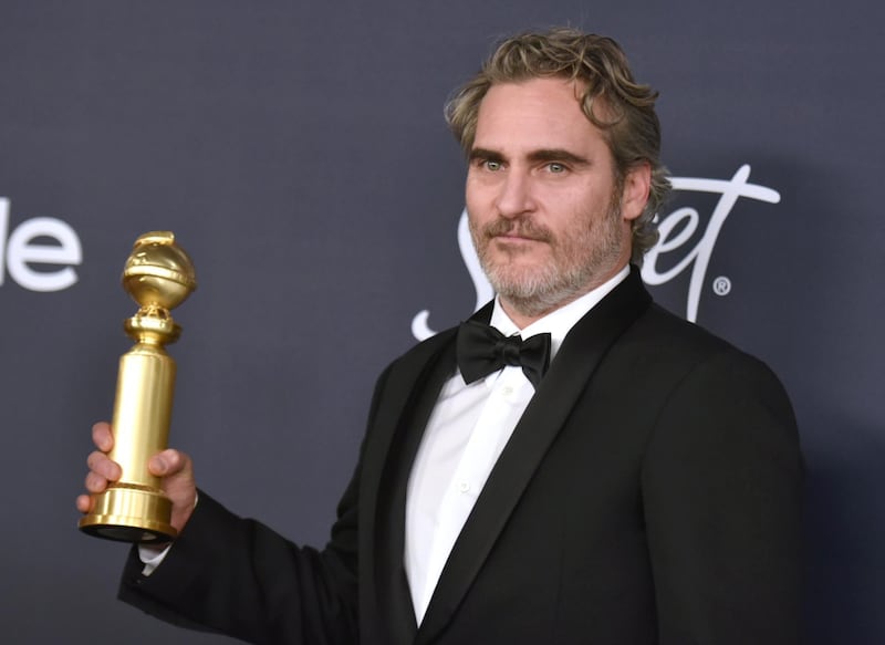 Joaquin Phoenix poses with his award for award for Best Performance by an Actor in a Motion Picture - Drama for his role in 'Joker', during the 77th annual Golden Globe Awards on January 5, 2020, at The Beverly Hilton hotel in Beverly Hills, California. AP