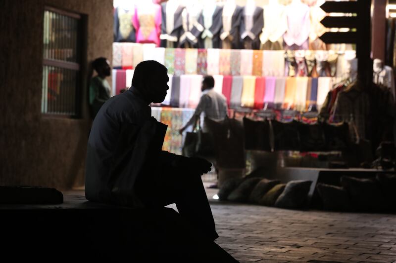 Traders wait for customers in Bur Dubai's main souq. The Bur Dubai side is better known for its textiles and tourist souvenirs. The Deira side is better associated with the gold market and perfumes.
