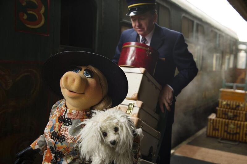 Muppet character Miss Piggy and her dog Foo-Foo in a scene from the movie. Disney, Jay Maidment / AP photo