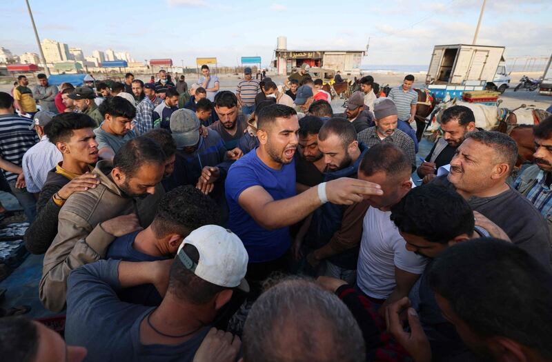 A Palestinian fisherman calls for bids as the day's catch is auctioned off at Gaza City's main fishing port. AFP