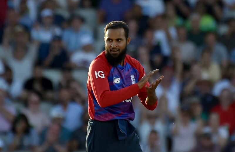 England's Adil Rashid celebrates the dismissal of Pakistan's Shadab Khan during the third T20 international at Old Trafford in Manchester on Tuesday. AP