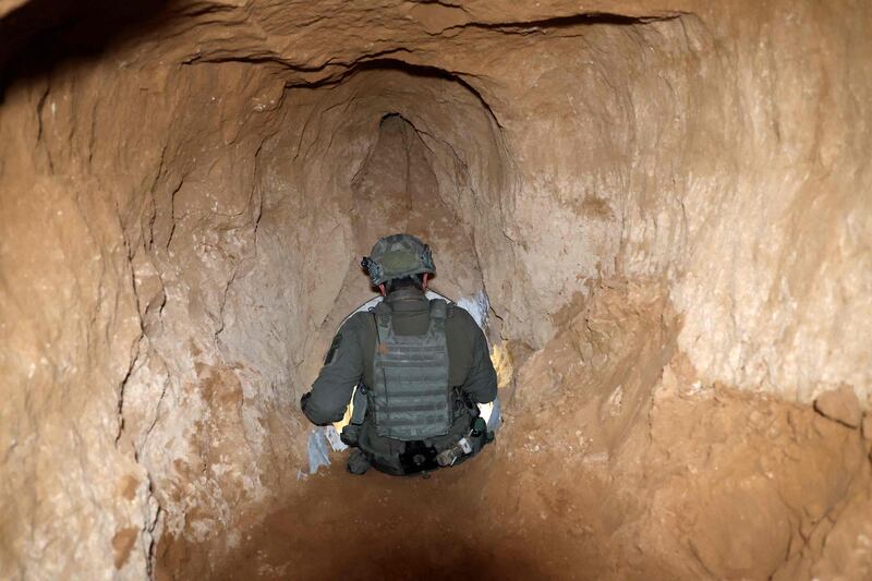 An Israeli soldier exits what the Israeli army claims was a 'Hamas command tunnel' underneath an UNRWA compound in Gaza city. AFP