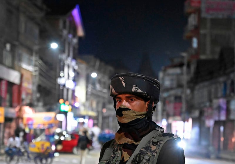 An Indian Paramilitary trooper stands guard in Srinagar on August 4, 2019. AFP