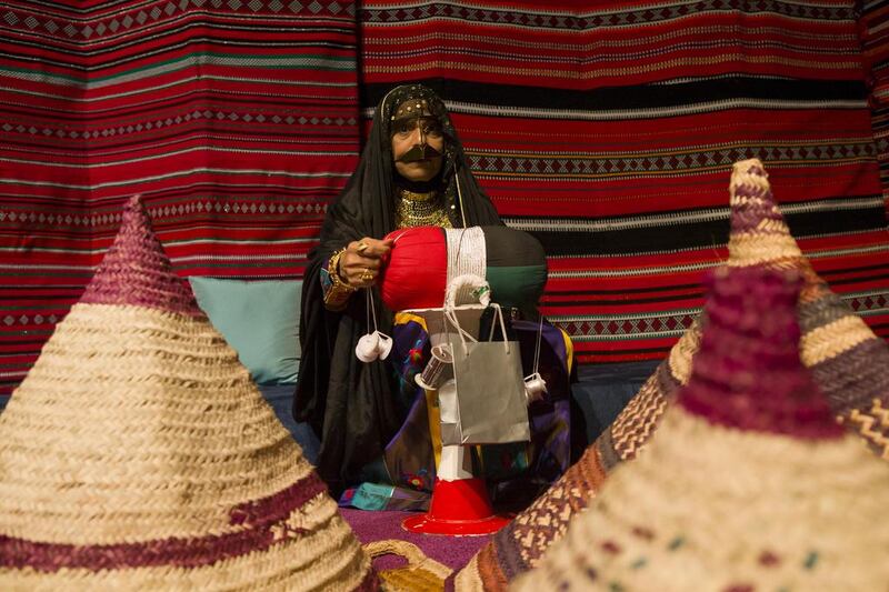 Safia Al Saadi from the General Woman's Union Handcraft Center demonstrates a tradition weaving technique at the Ramadan Nights being held at ADNEC. Antonie Robertson/The National