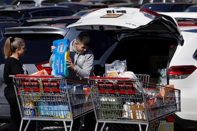 People load Clorox into their car in the Costco parking lot after the first confirmed case of coronavirus was announced in New York State, in the Brooklyn borough of New York City, New York, U.S., March 2, 2020. REUTERS/Andrew Kelly