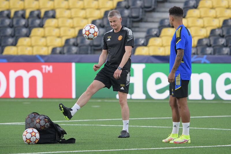 Manchester United manager Ole Gunnar Solskjaer with Jadon Sancho. AFP