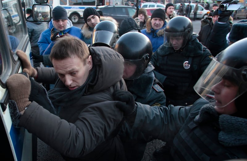 Police detain Mr Navalny at a rally in Lubyanka Square in Moscow, in 2012. AP