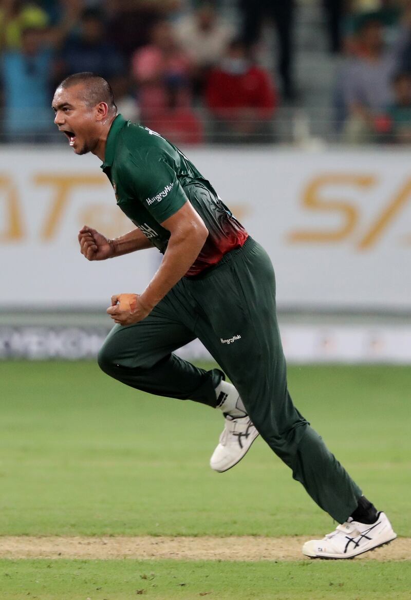 Bangladesh bowler Taskin Ahmed celebrates after taking the wicket of UAE's Muhammad Waseem for 18.