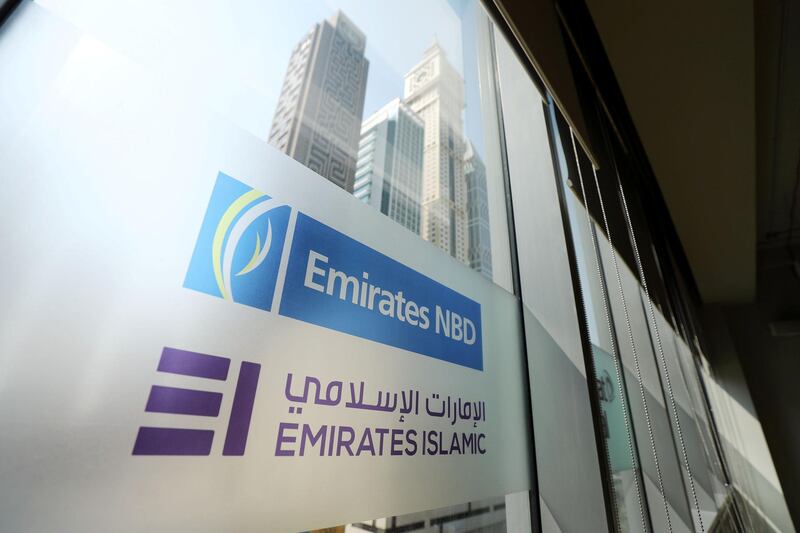 Dubai, United Arab Emirates - August 07, 2019: Stock. A Emirates NBD and Emirates Islamic bank sign in the DIFC. Wednesday the 7th of August 2019. DIFC, Dubai. Chris Whiteoak / The National