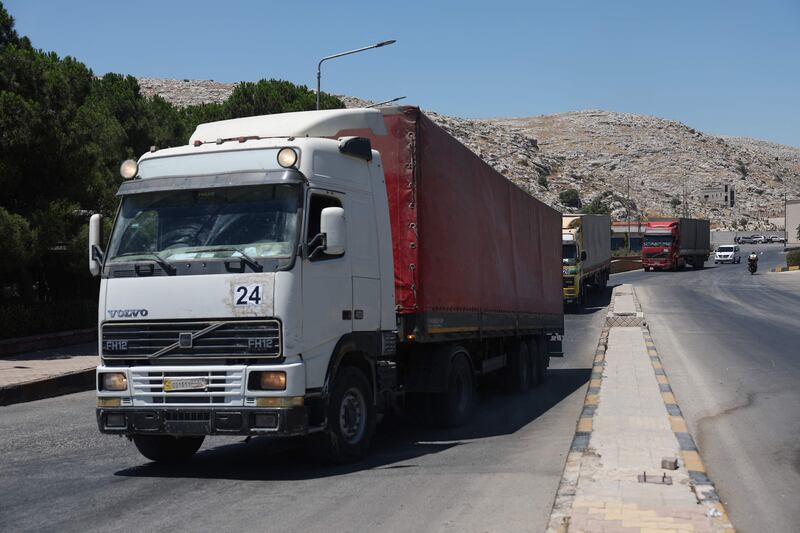 A convoy carrying humanitarian aid arrives in Syria through the Bab Al Hawa border crossing with Turkey. AFP