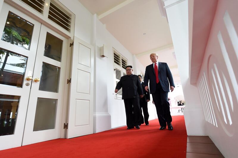 North Korea's leader Kim Jong Un walks with US President Donald Trump at the start of their historic US-North Korea summit. Saul Loeb / AFP