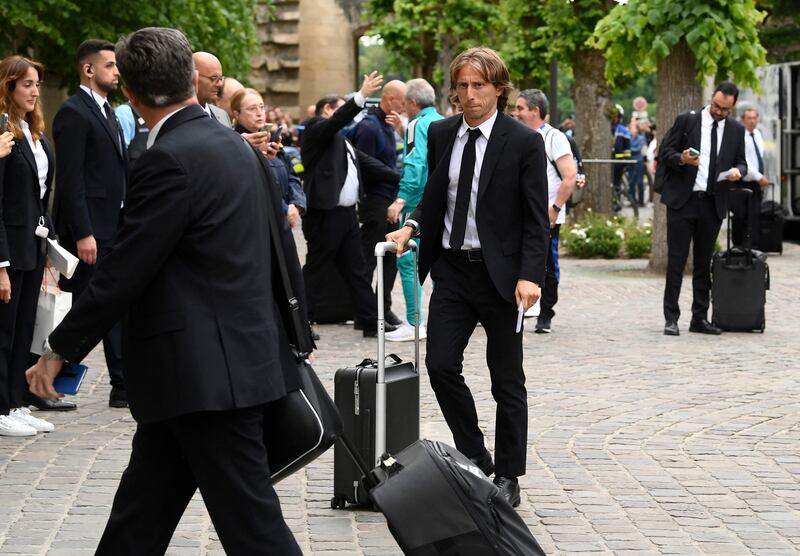 Real Madrid's midfielder Luka Modric, centre, arrives at the team's hotel in Chantilly ahead of the Champions League final against Liverpool. AFP