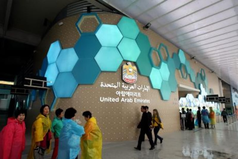 In this photo taken on Monday, May 14, 2012, visitors walk past near the UAE  Pavilion for the 2012 Yeosu Expo in Yeosu, south of Seoul, South Korea. The expo opened for three months on May 12 under the theme of "The Living Ocean and Coast: Diversity of Resources and Sustainable Activities." (AP Photo/Newsis, Ahn Hyun-joo) KOREA OUT *** Local Caption ***  South Korea UAE Expo .JPEG-08f00.jpg